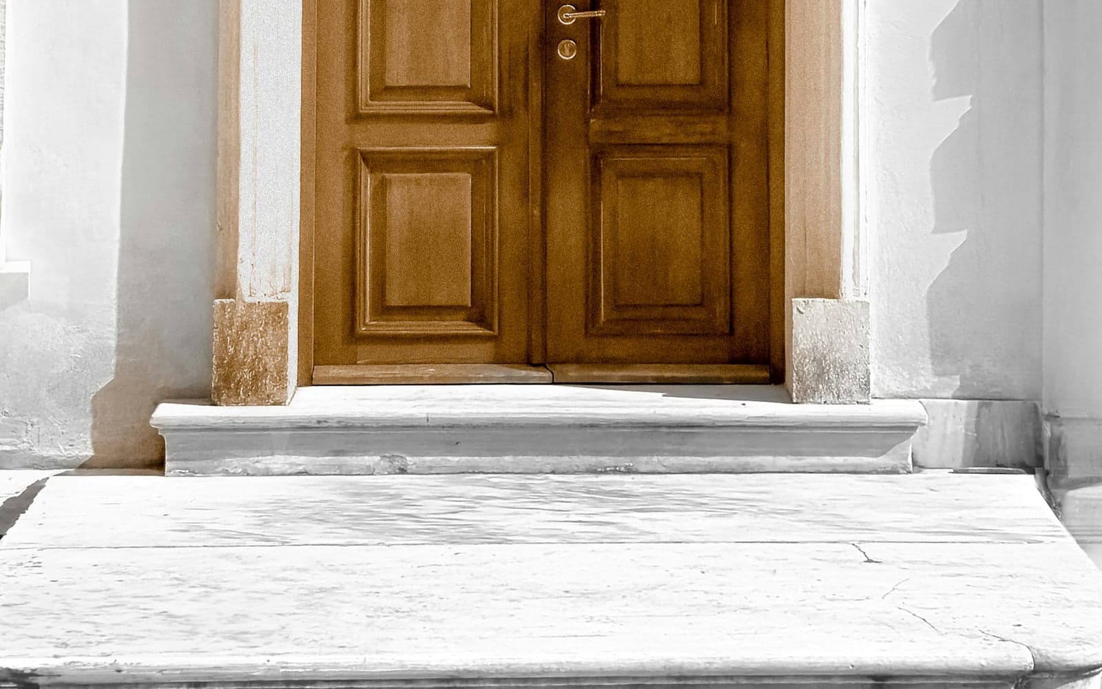 An ornate stone doorway on a polished Nisantasi street